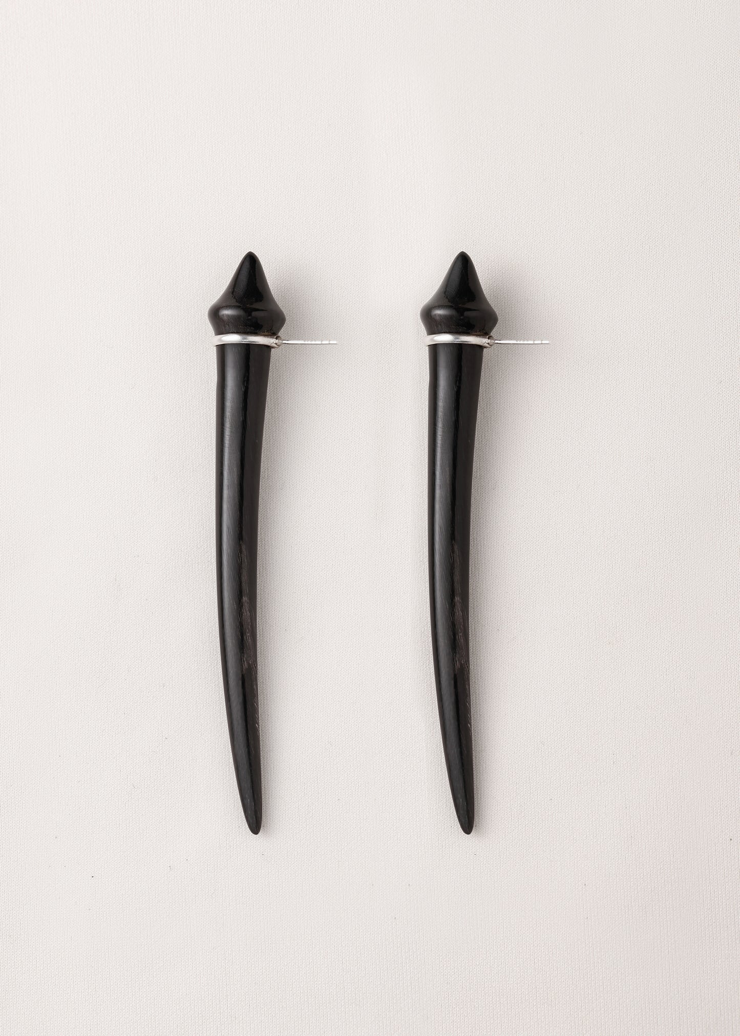 Long black buffalo horn tooth earrings by RIVERLAKE, showcasing a sleek, elongated design for a modern look.