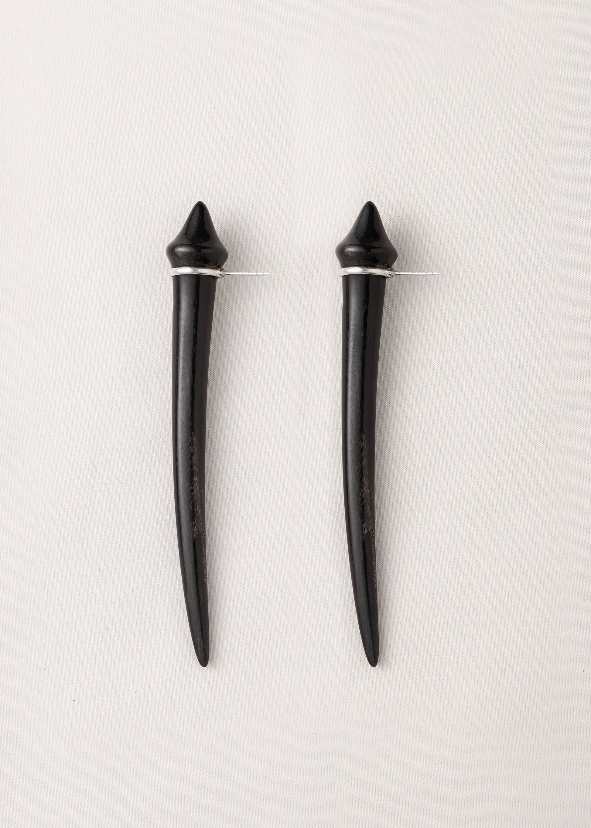 Long black buffalo horn tooth earrings by RIVERLAKE, showcasing a sleek, elongated design for a modern look.