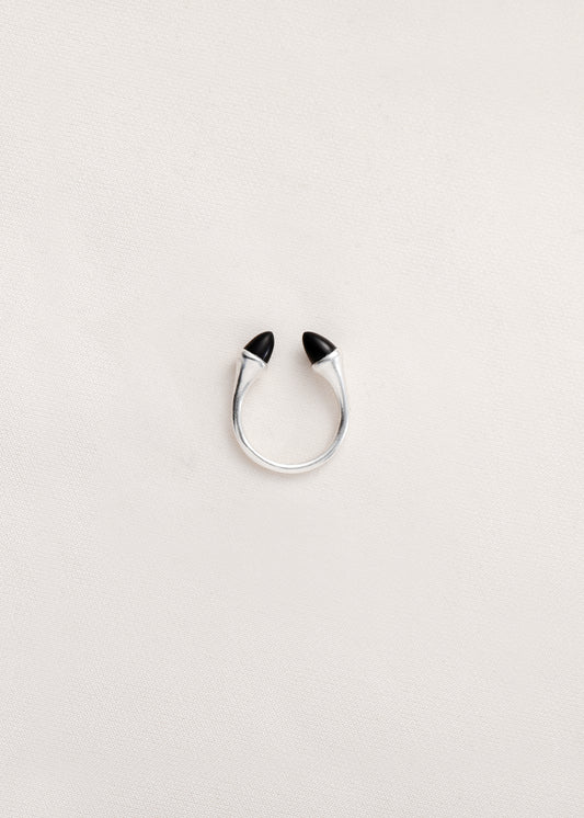 Black buffalo horn teeth ring by RIVERLAKE, showcasing a unique, textured design in a circular shape.