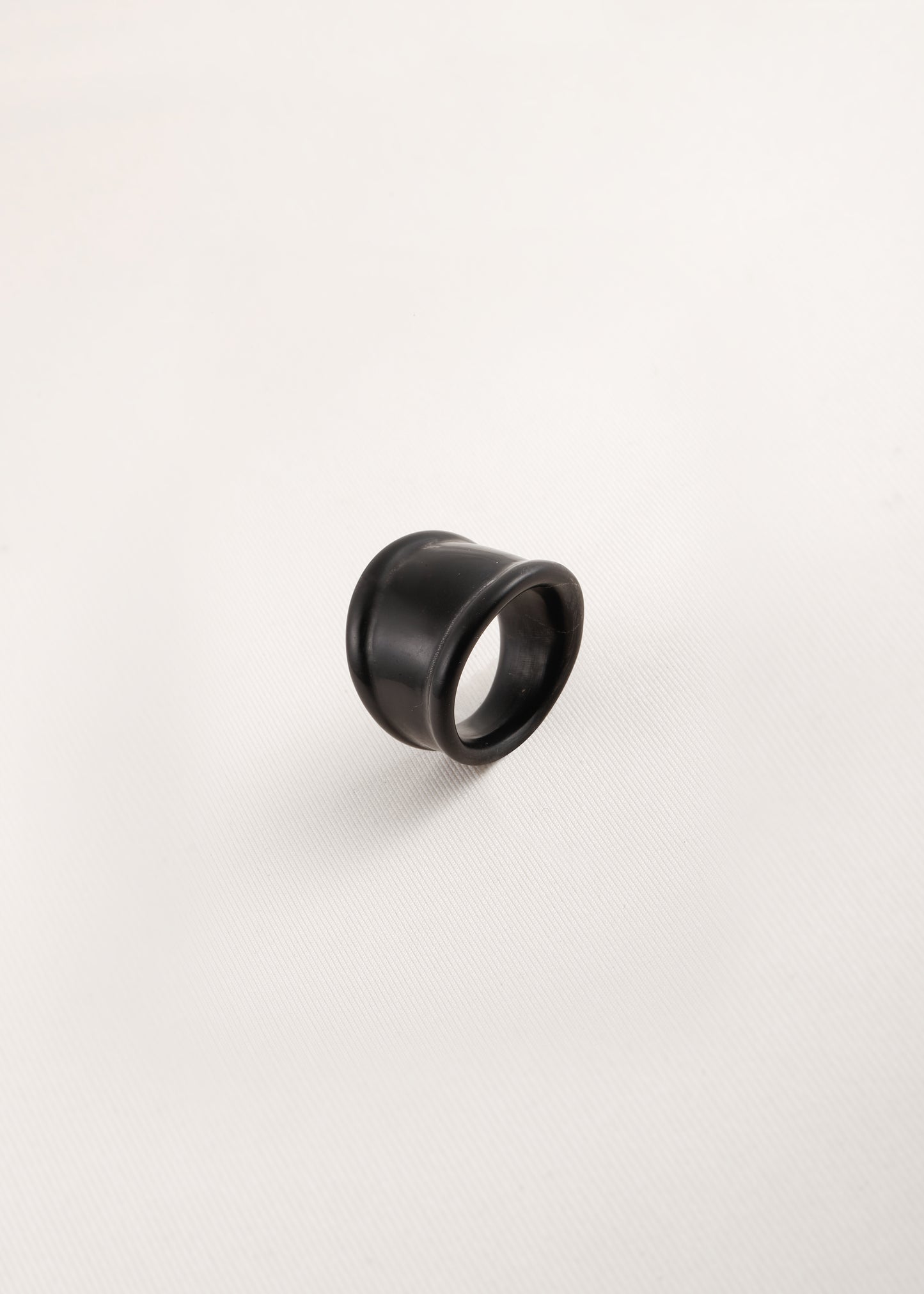 Muted Ridge Ring by RIVERLAKE in black buffalo horn with a textured finish, showcasing its unique design and craftsmanship.