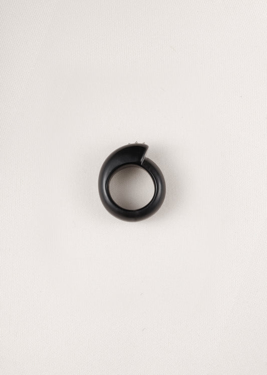Black buffalo horn curl ring with silver rivets by RIVERLAKE, showcasing its unique, textured design and elegant finish.