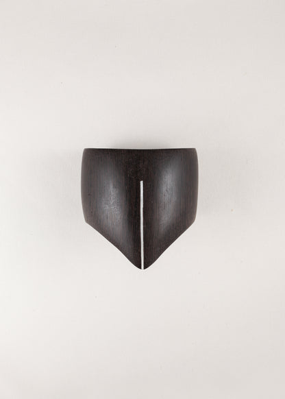 RIVERLAKE Shield Cuff in ebony wood featuring a sleek silver inlay design, showcasing elegant craftsmanship.