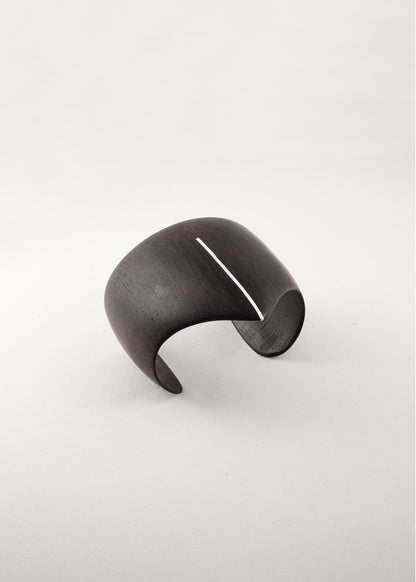 RIVERLAKE Shield Cuff in ebony wood with intricate silver inlay design, showcasing a stylish and elegant accessory.