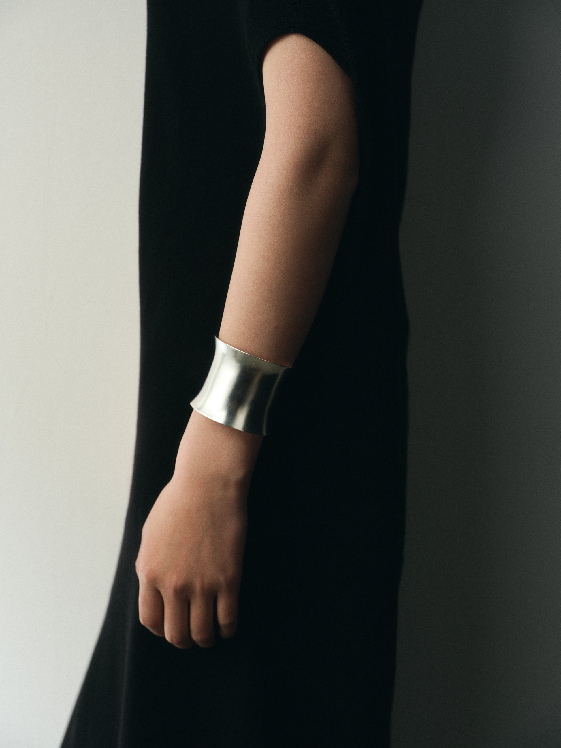 RIVERLAKE Argent Cuff featuring a sleek metallic design with a polished finish, elegantly displayed on a neutral background.