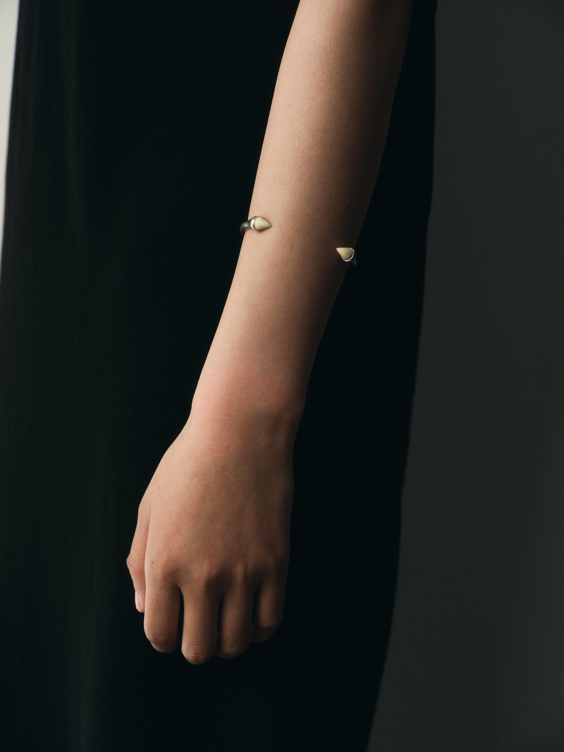 RIVERLAKE Talon Cuff in sleek black buffalo horn with a unique design, showcasing elegant craftsmanship and texture.