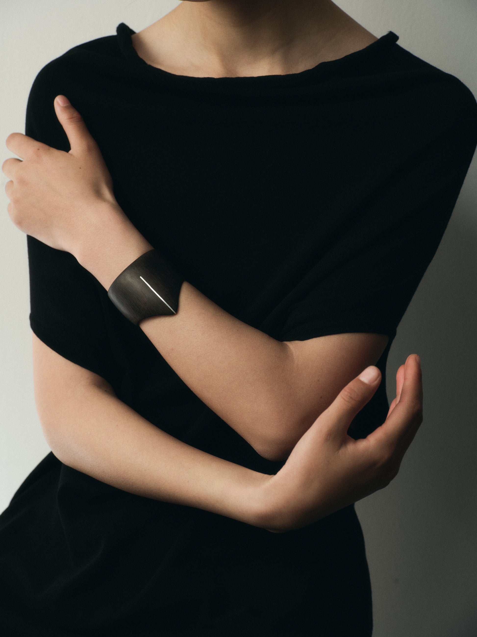 RIVERLAKE Shield Cuff in ebony wood featuring intricate silver inlay detail.