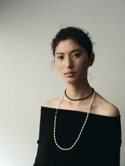 Dusk & Dawn Strands necklace featuring antler and black buffalo horn by RIVERLAKE, showcasing a unique natural design.