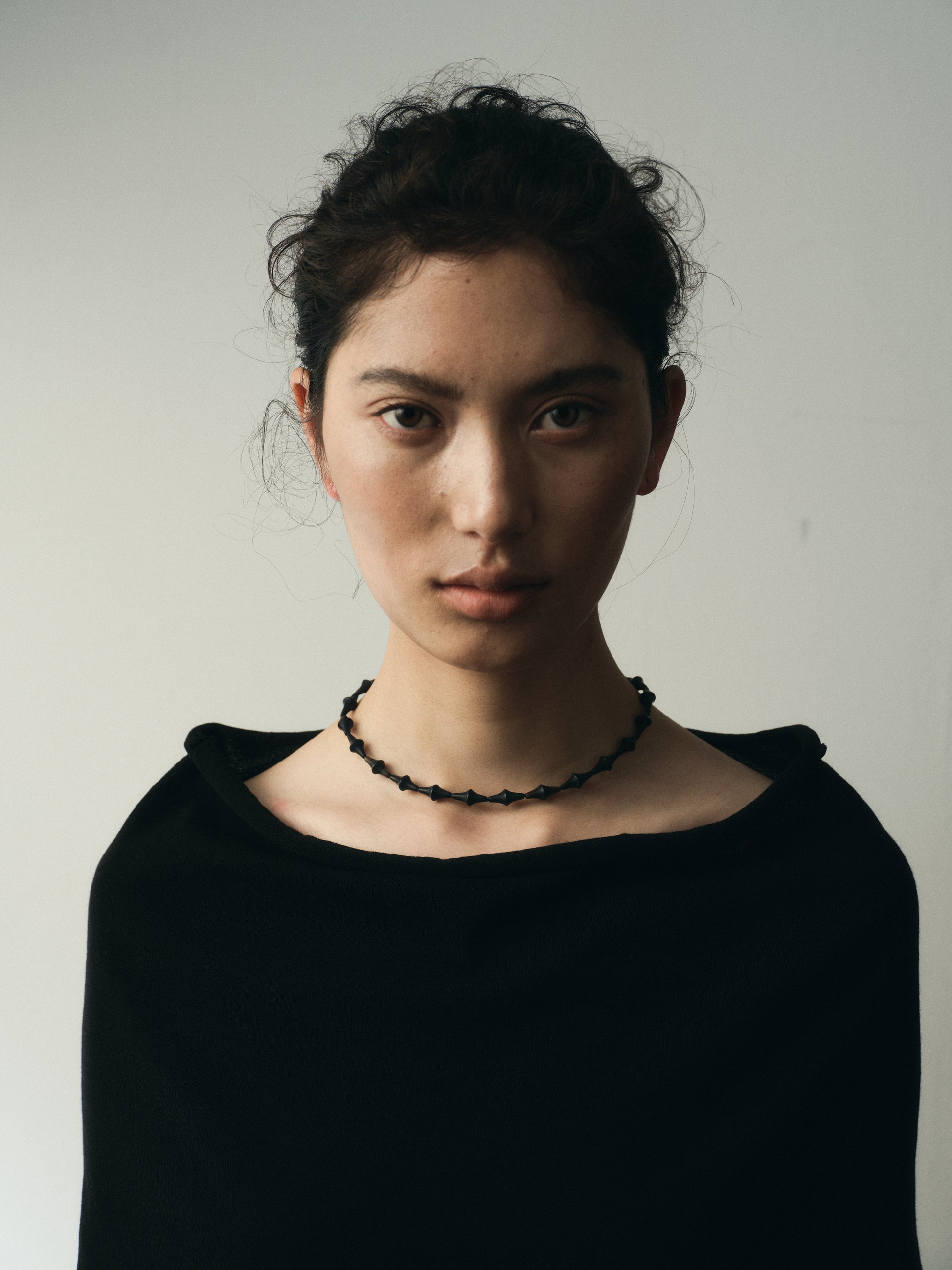 RIVERLAKE Nyx Necklace featuring a sleek design in black buffalo horn with intricate detailing.