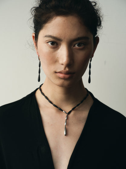 Long spring earrings made of black buffalo horn by RIVERLAKE, featuring a sleek and elegant design.