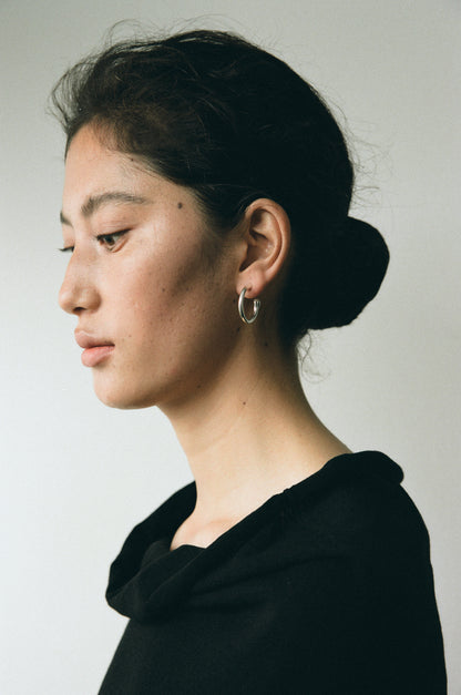 Small yellow buffalo horn hoops by RIVERLAKE, showcasing a unique, textured design and lightweight construction.