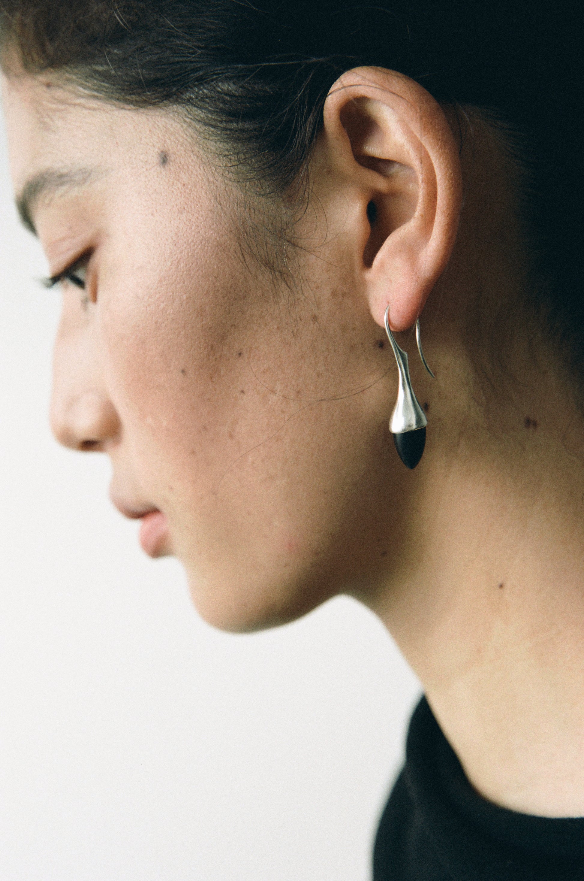 Black buffalo horn Dewdrop earrings by RIVERLAKE, featuring a sleek, modern design with elegant curves.