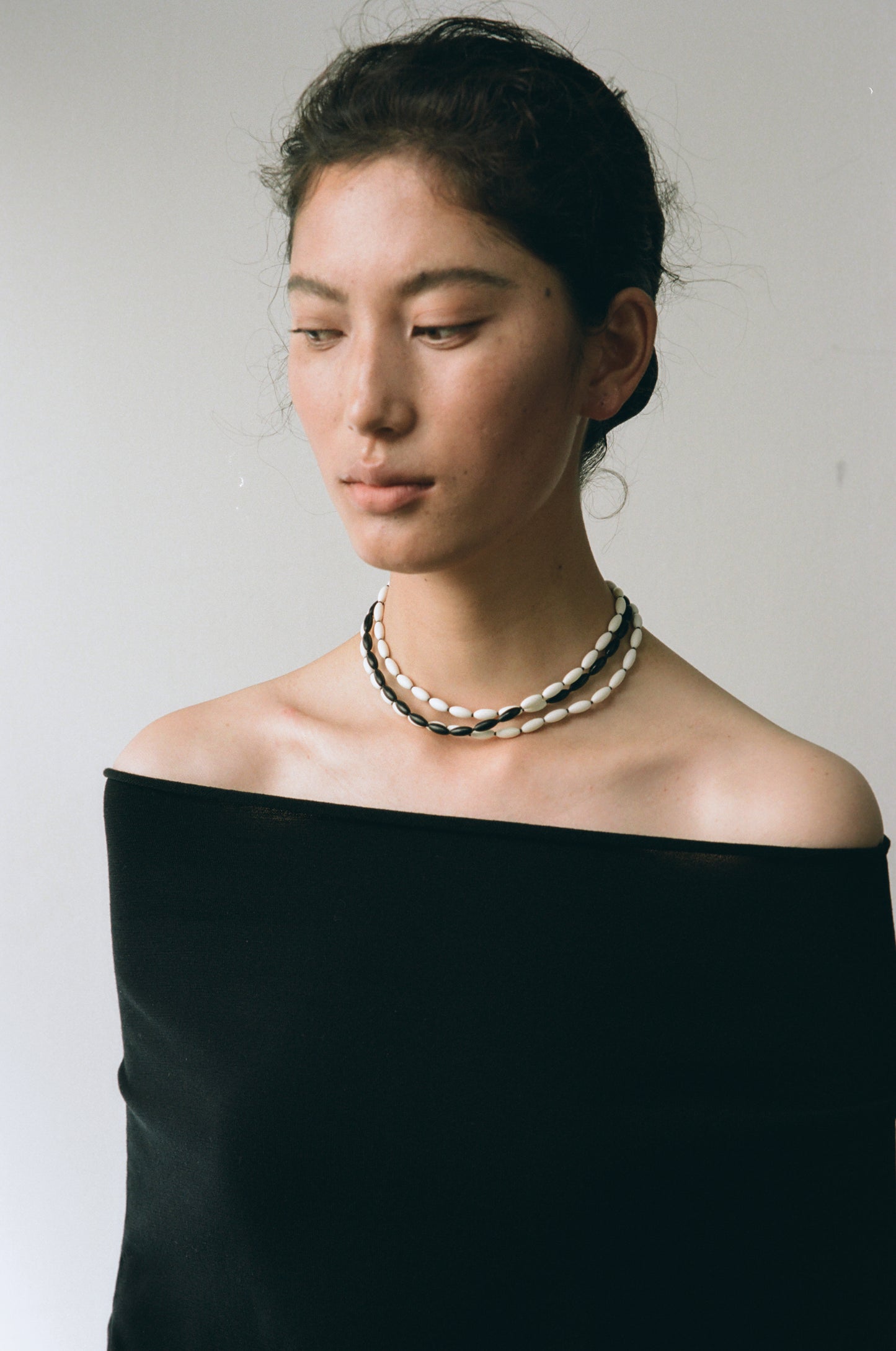 Dusk & Dawn Strands necklace featuring antler and black buffalo horn by RIVERLAKE. Elegant, earthy design.