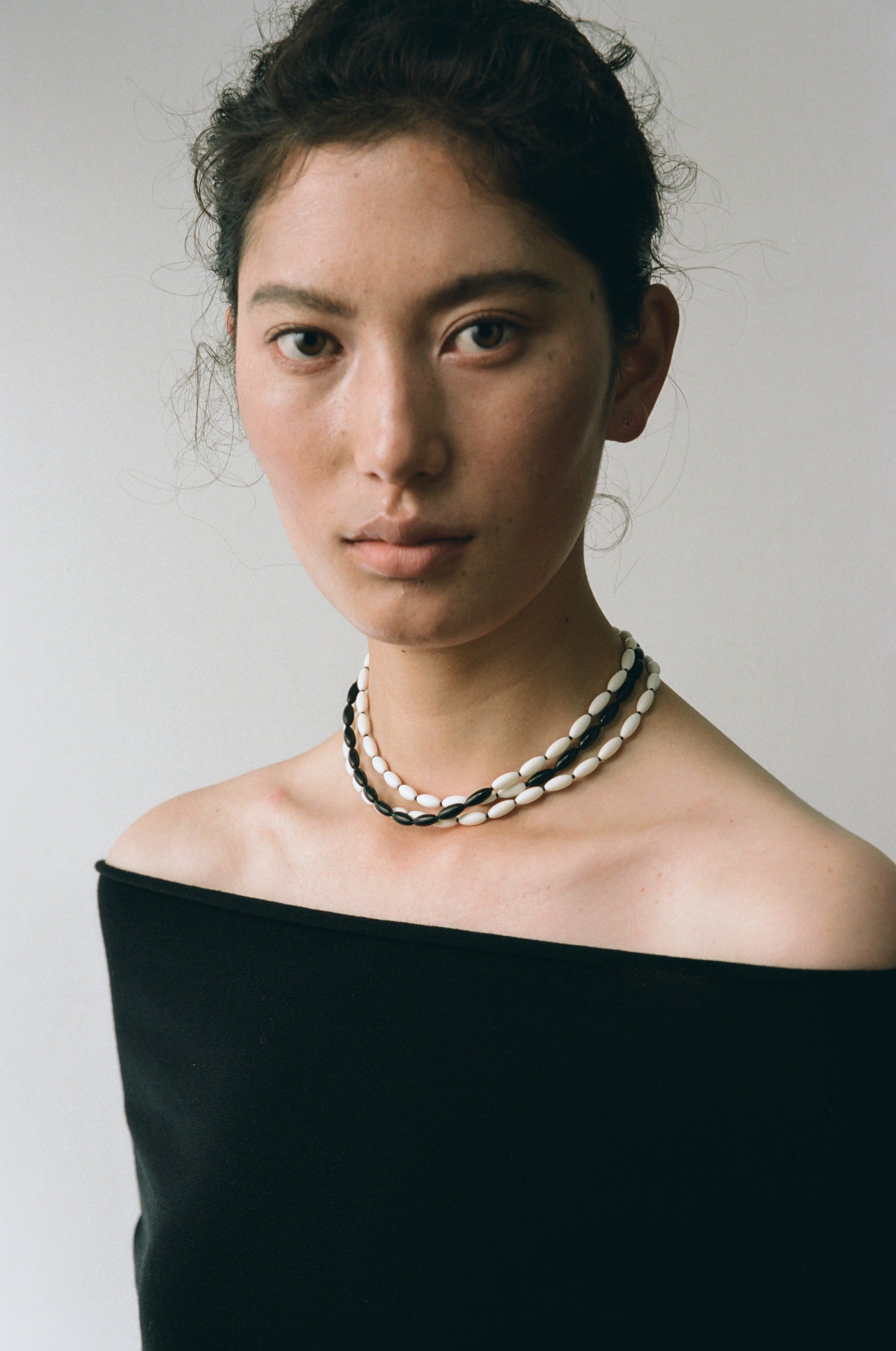 Dusk & Dawn Strands necklace featuring antler and black buffalo horn by RIVERLAKE, showcasing unique natural textures.