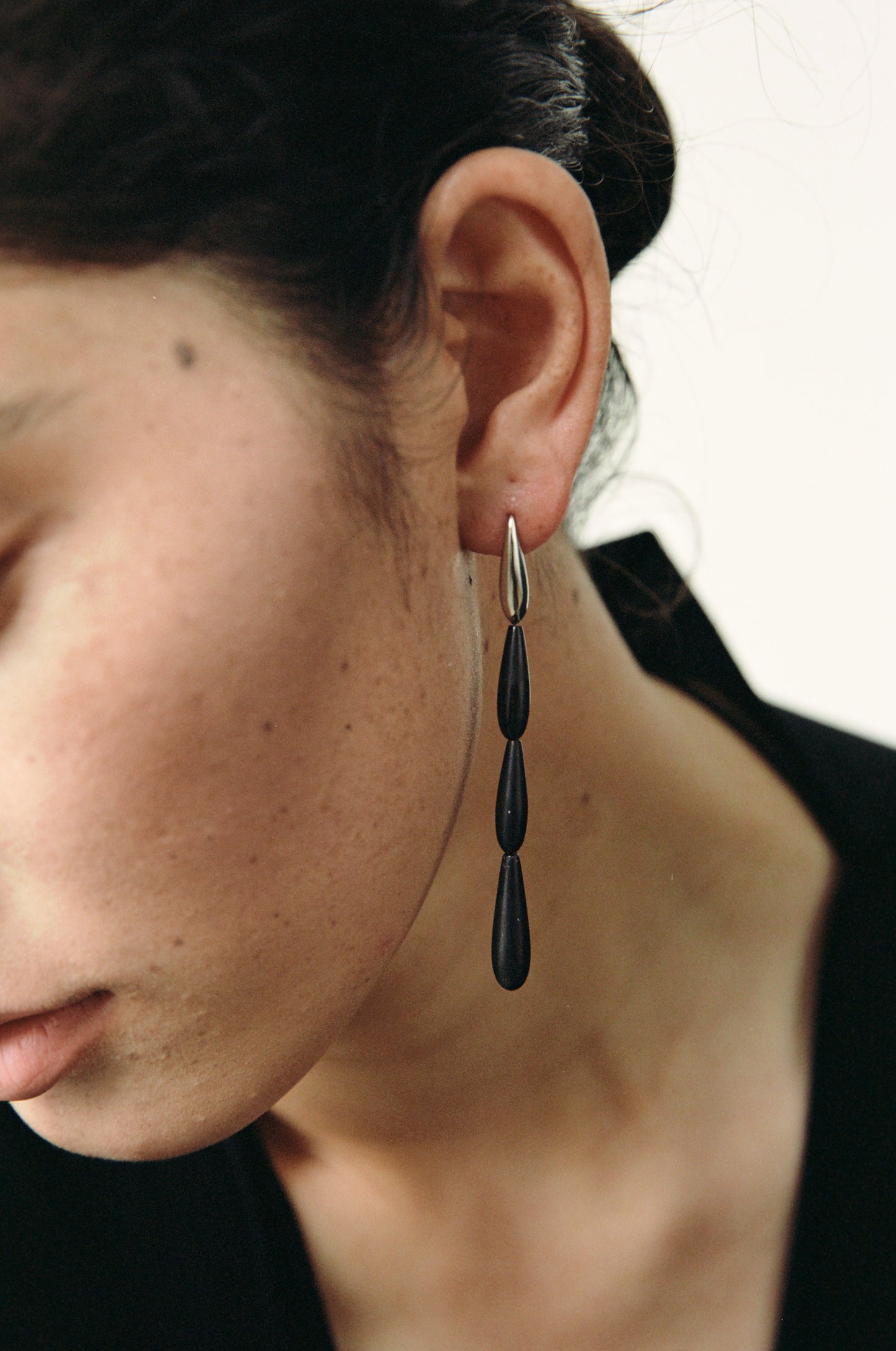 Long spring earrings made of black buffalo horn by RIVERLAKE, showcasing a sleek and elegant design.