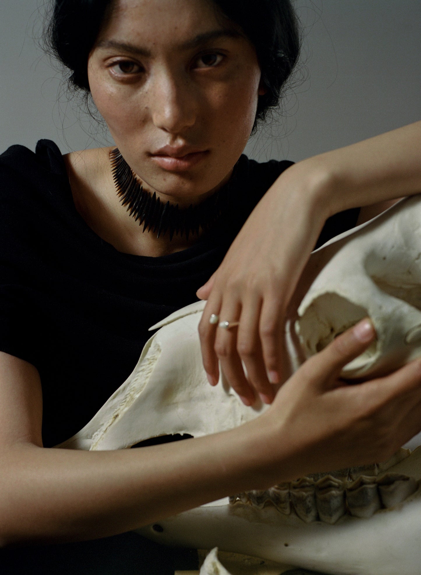 Black buffalo horn teeth ring by RIVERLAKE, featuring a unique textured design and smooth finish.