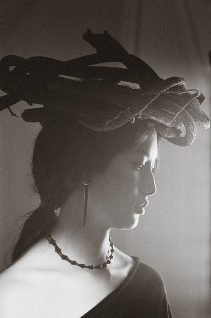 RIVERLAKE Nyx necklace featuring a sleek black buffalo horn pendant on a delicate chain.