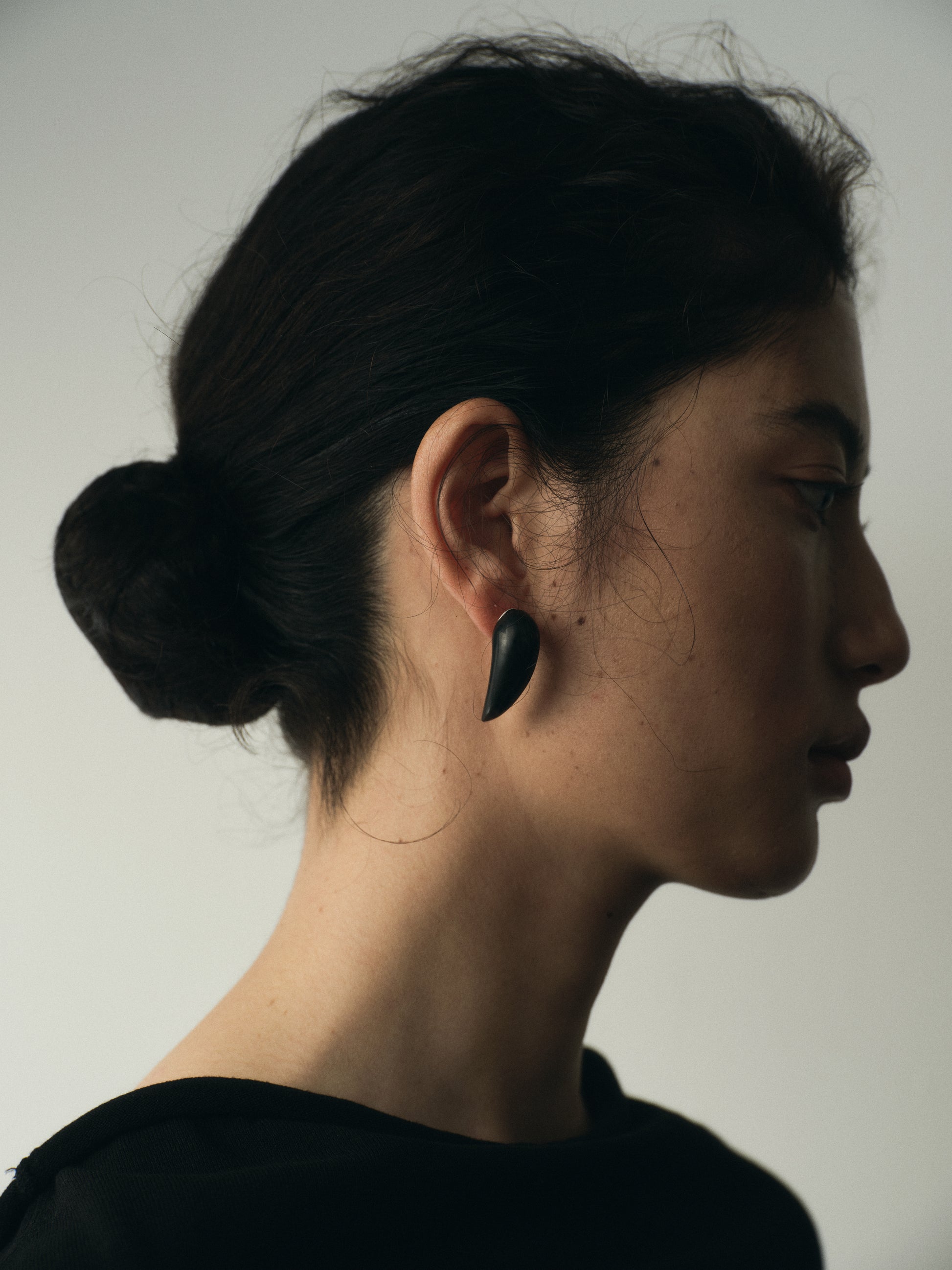 Medium Fang Earrings in black buffalo horn by RIVERLAKE, showcasing a unique, bold design and natural texture.