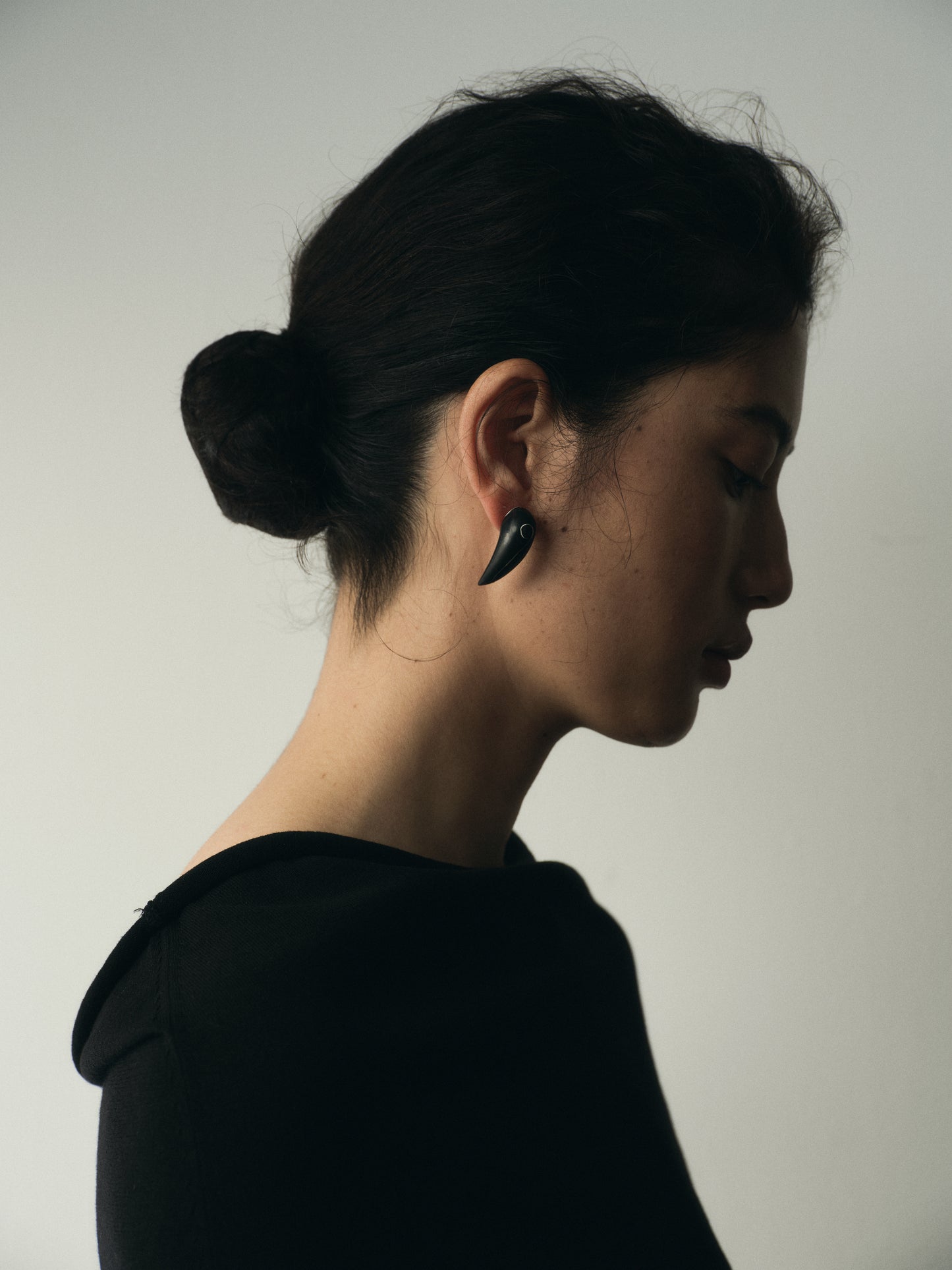 Medium Fang Earrings by RIVERLAKE featuring black buffalo horn with elegant silver inlay design.