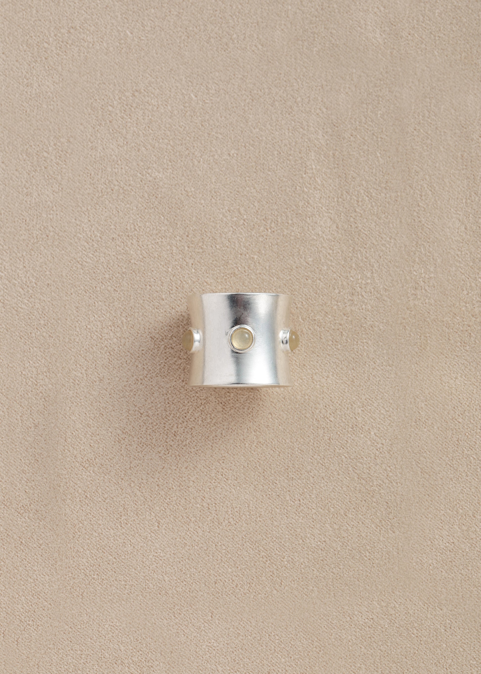 RIVERLAKE Pupil Ring crafted from yellow buffalo horn, showcasing a smooth, polished finish and unique texture.