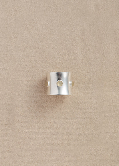 RIVERLAKE Pupil Ring crafted from yellow buffalo horn, showcasing a smooth, polished finish and unique texture.