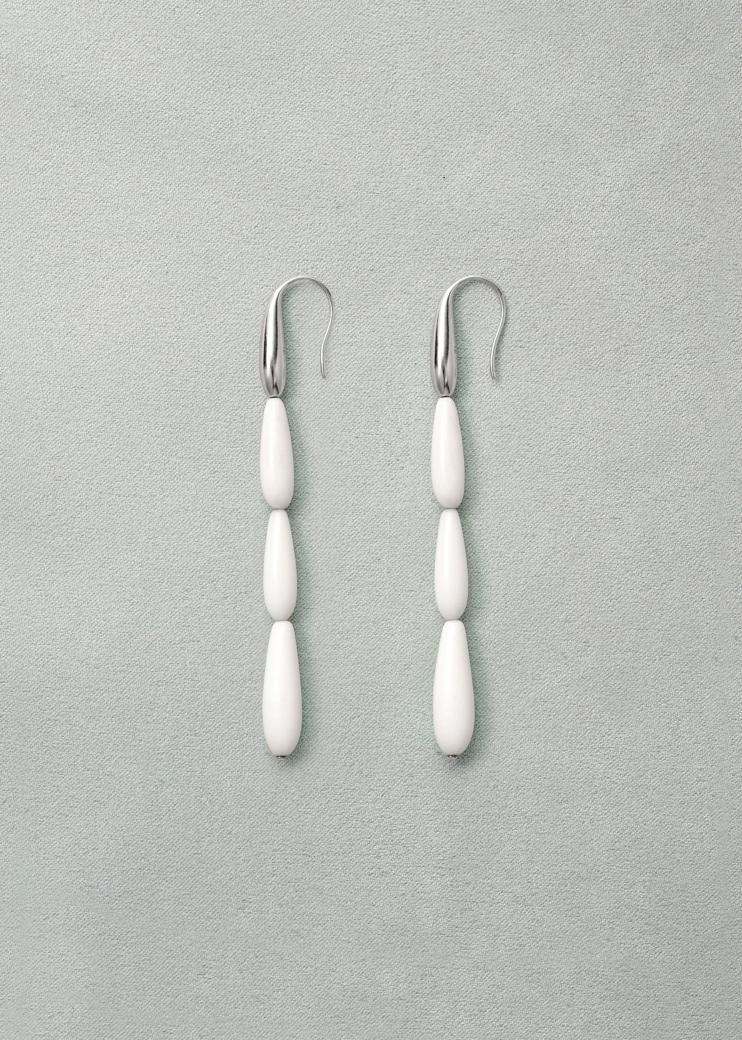 Long spring earrings in antler design by RIVERLAKE, showcasing elegant curves and natural texture.