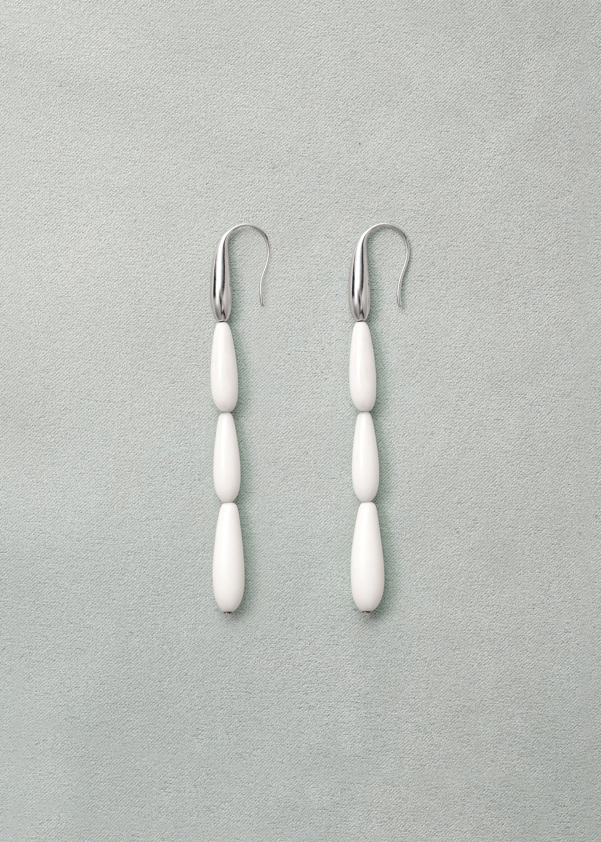 Long spring earrings in antler design by RIVERLAKE, showcasing elegant curves and natural texture.