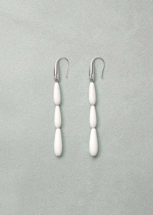 Long spring earrings in antler design by RIVERLAKE, showcasing elegant curves and natural texture.