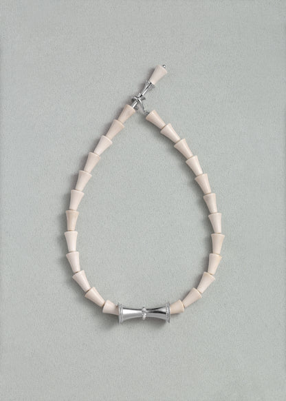 RIVERLAKE antler cone necklace featuring a unique design with earthy tones and a natural finish.