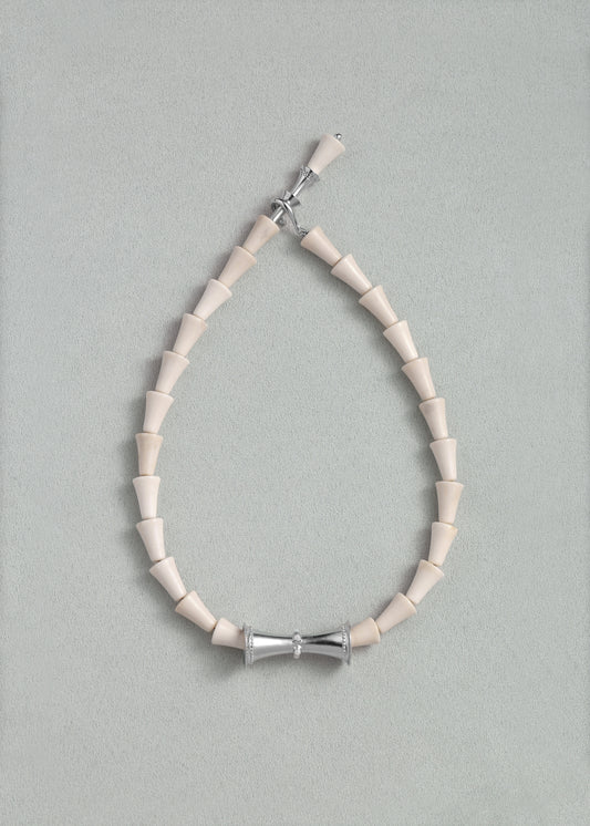 RIVERLAKE antler cone necklace featuring a unique design with earthy tones and a natural finish.