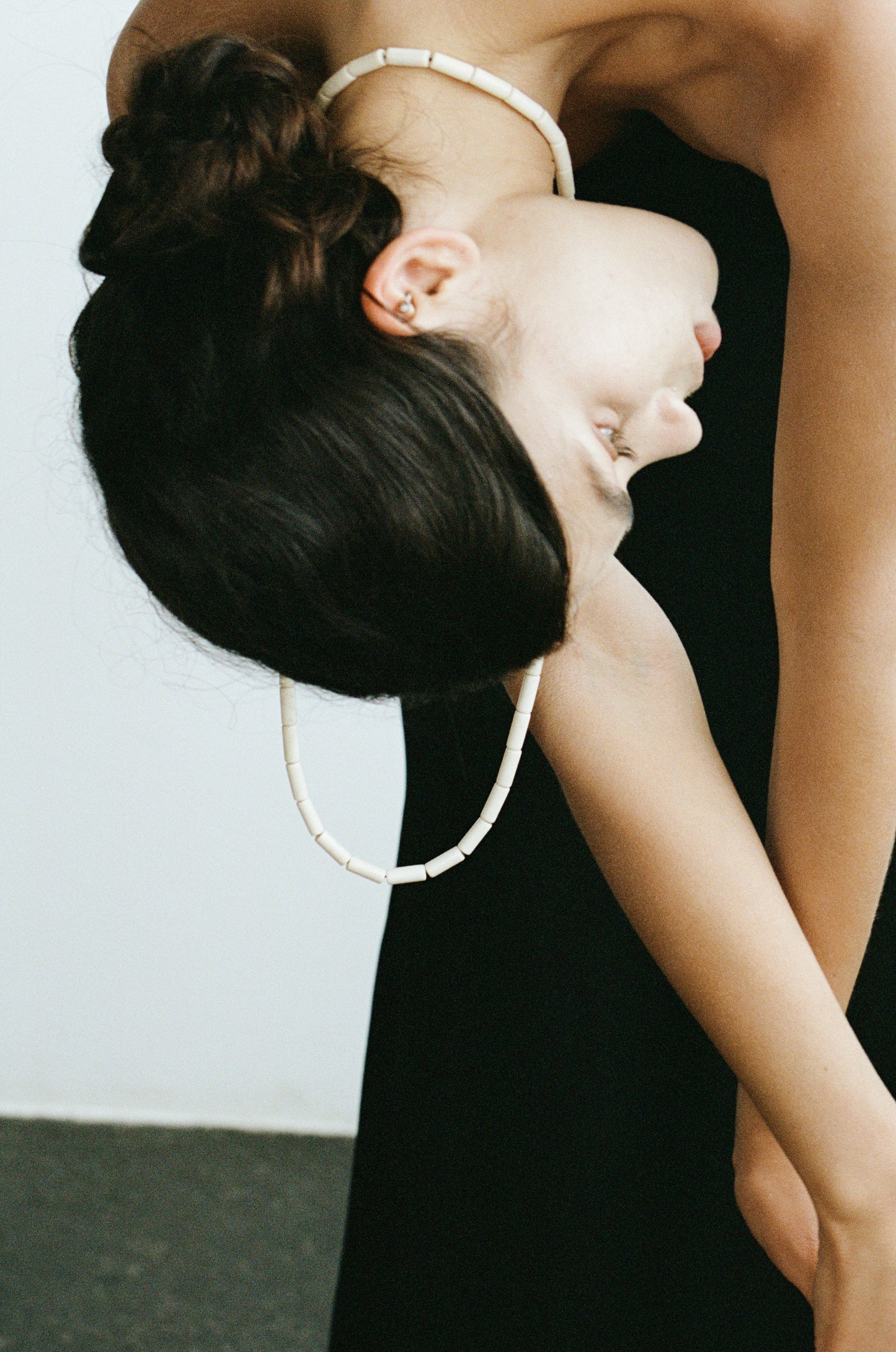 River Rhythm Necklace by RIVERLAKE featuring an antler design with intricate detailing and a natural finish.