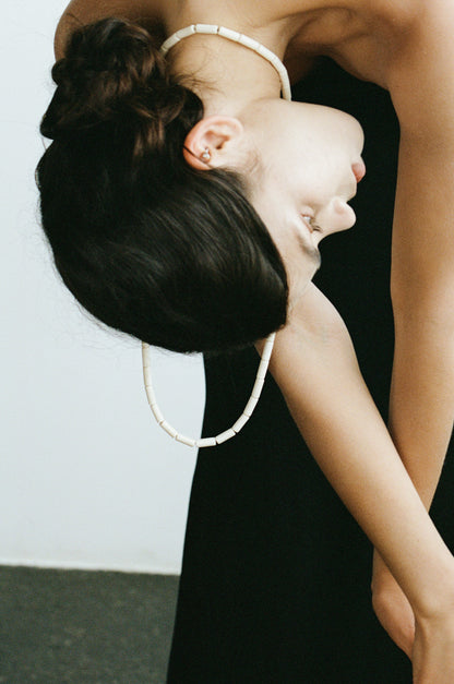 River Rhythm Necklace by RIVERLAKE featuring an antler design with intricate detailing and a natural finish.