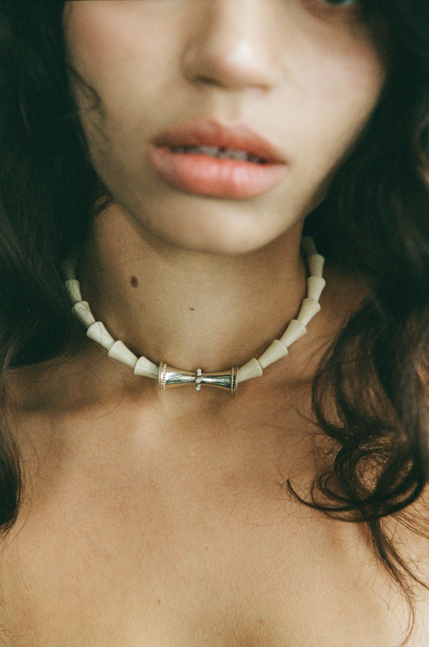 Antler cone necklace by RIVERLAKE, featuring a unique design with earthy tones and a rustic finish.