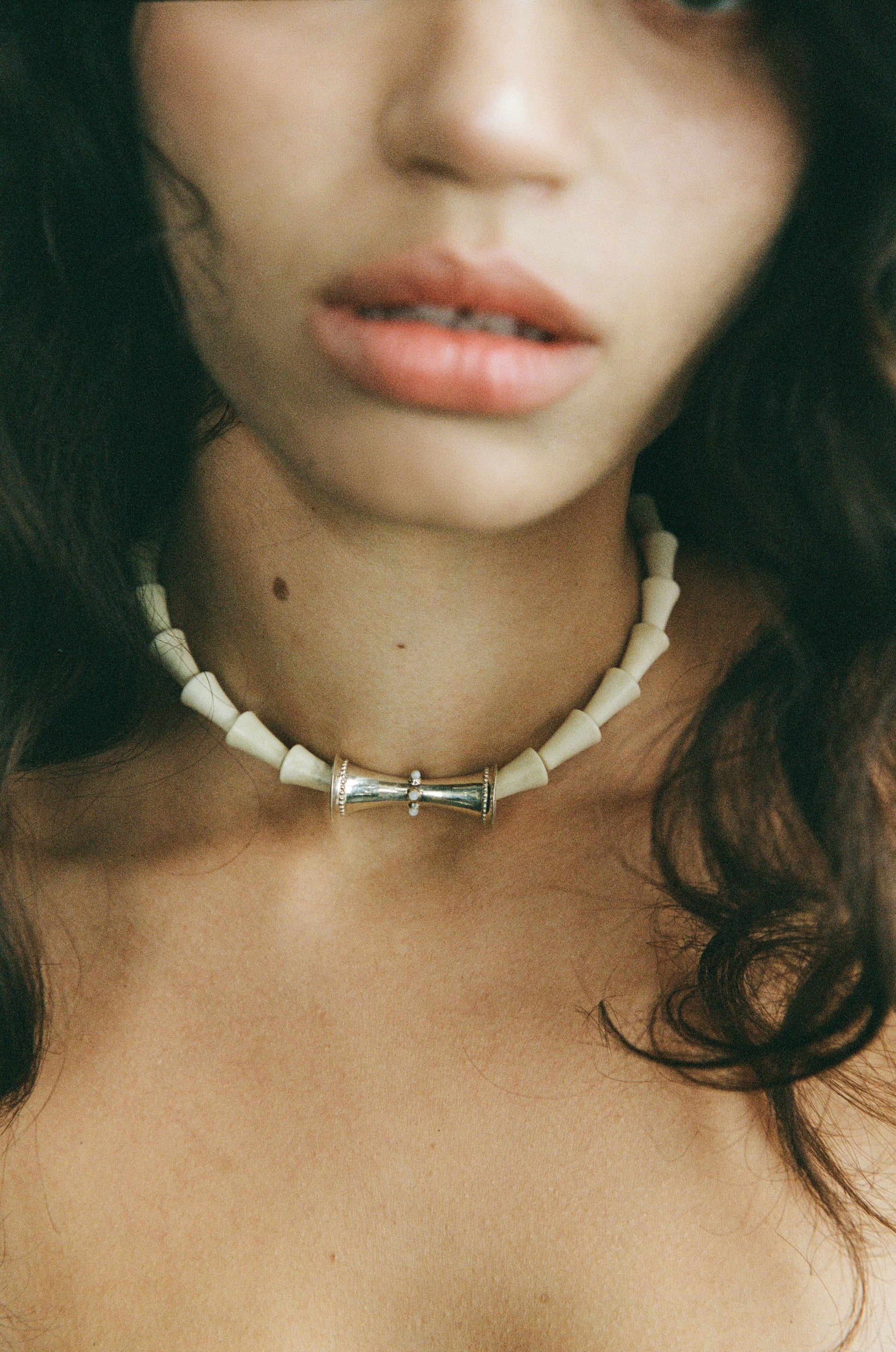 Antler cone necklace by RIVERLAKE, featuring a unique design with earthy tones and a rustic finish.