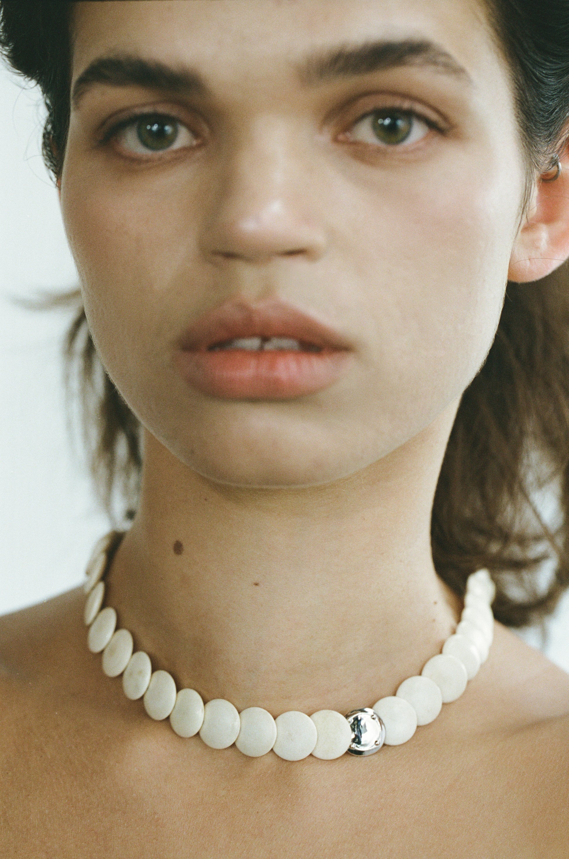 Coco Necklace in Antler by RIVERLAKE, featuring a unique design with earthy tones and a delicate chain.